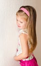 Naughty little girl is standing in the corner Royalty Free Stock Photo