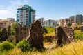 Naula Ancient City ruins among modern buildings of Mahmutlar