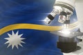 Nauru science development concept - microscope on flag background. Research in genetics or cell life 3D illustration of object