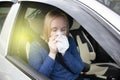 Nausea during a car trip. A blonde woman suffers from kinetosis. The concept of motion sickness in diseases of the transport and