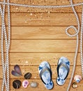 Nautical border with Flip-Flops, pebbles, sea shells and ropes on a background of wooden boards with copyspace for your text