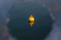 Nautical buoy floating in the water of Lake Geneva in Switzerland Royalty Free Stock Photo