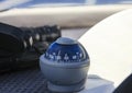 Nautical compass and binoculars on the dashboard of marine fishing yacht Royalty Free Stock Photo