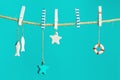 Nautical concept with sea lifestyle decorations hanging on rope with turquoise. Sea toys lifeline, seastars Royalty Free Stock Photo