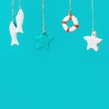 Nautical concept with sea lifestyle decorations hanging on rope with turquoise. Sea toys lifeline, seastars Royalty Free Stock Photo