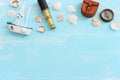 nautical concept with white sail boat, seashells, old retro compass and binoculars over blue wooden background Royalty Free Stock Photo