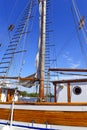 Nautical maritime scene with ropes and mast on a ship on a dock by the water