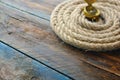 Nautical navigation background. Sea rope with a compass on a wooden desk.