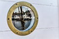 Nautical porthole With reflection, close up Royalty Free Stock Photo