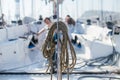 Pile of nautical ropes attached to deck or mast of sailboat Royalty Free Stock Photo