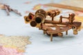 nautical sextant with optics, compass and ruler lying on paper world map Royalty Free Stock Photo