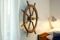 nautical steering wheel mounted on bedroom wall