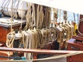 Nautical tackles and equipment of the old tall ship. Rigging ropes and rope ladder on the mast of sailing vessel