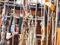 Nautical tackles and equipment of the old tall ship. Rigging ropes and rope ladder on the mast of sailing vessel