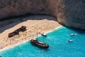 Navagio Beach. Old ship and tourist boats on the coast of Zakynthos