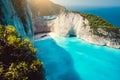 Navagio beach. Shipwreck on beach in morning light. Turquoise water and limestone rocks surrounding. Famous landmark Royalty Free Stock Photo