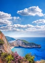 Navagio beach with shipwreck and flowers against sunset on Zakynthos island in Greece Royalty Free Stock Photo