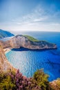 Navagio beach with shipwreck and flowers against sunset on Zakynthos island in Greece Royalty Free Stock Photo