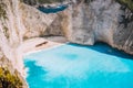 Navagio beach with turquoise blue sea water surrounded by huge white cliffs. Famous landmark location on Zakynthos Royalty Free Stock Photo