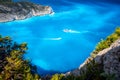 Navagio beach, Zakynthos, Greece. Tourist trip boats visiting and leaving Shipwreck bay with turquoise water beach