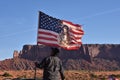 Navajo Indian Raising the American Flag Royalty Free Stock Photo