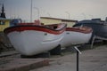 Lifeboats on the shore on an overcast evening closeup