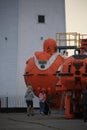 People near the old deep-submergence rescue vehicles AS-5 and AS-22 in evening