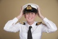Naval officer holding her hat