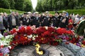 Naval officers, veterans of World War II, saluting near Eternal Flame in the Glory park. Celebration of Victory Day