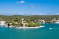 Naval storehouse and careening wharf in Mahon, Spain. Boats in sea harbor. Sea coast on sunny blue sky. Summer vacation Royalty Free Stock Photo