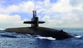 Naval submarine on open blue sea surface Royalty Free Stock Photo