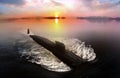 Naval submarine on sea surface during sunset near the coast line Royalty Free Stock Photo