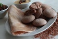 Navara rice idly and ghee roast dosa served together on a plate