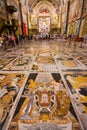 Nave and tombstones with altar in background in Valletta Cathedral, Malta