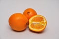 Whole and sliced navel oranges on a seamless background Royalty Free Stock Photo