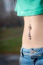 Navel piercing close up Royalty Free Stock Photo