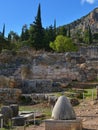 Navel stone in Delphi, Greece Royalty Free Stock Photo