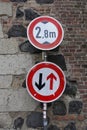 Navigating History: Road Signs Governing Passage at the Historic Rheintor in Zons, Setting Vehicle Limit at 2.8m during Zons