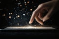 Navigating a virtual galaxy with fingers on a radiant screen in the darkness of night Royalty Free Stock Photo