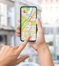 Navigation App With Street Map Opened On Smartphone In Female Hands