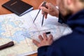 Navigation in the chart room on a sailing yacht