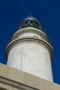 Navigation, lighthouse next to the Mediterranean Sea, blue sky w Royalty Free Stock Photo