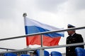 Navigation season opening in Moscow. Boat captain and Russian state flag tricolor
