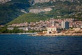 Navigational lighthouse stands in front of the town of Makarska, Croatia