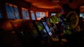 Navigator. pilot, captain as part of ship crew performing daily duties with VHF radio, binoculars on board of modern ship with