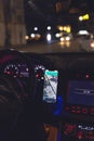 Navigator in a smartphone in a car at night, close-up. Royalty Free Stock Photo