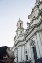 tourist looking at roman church navona famous monument