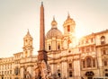 Navona Square in sunlight, Rome, Italy. Sant`Agnese church and Four Rivers fountain with Egyptian obelisk. Piazza Navona is famou Royalty Free Stock Photo