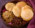 Navratri prasad thali - Brass plate consisting of halwa poori and chana Royalty Free Stock Photo