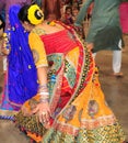 A beautiful women are dancing in action. Enjoying Hindu festival of Navratri Garba wearing traditional consume.